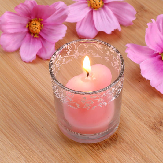 Rosa Herzkerze im Glas