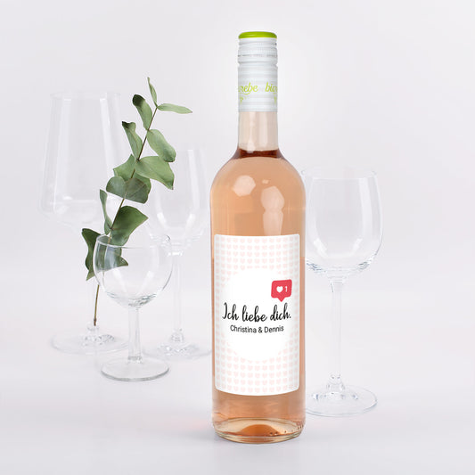 Roséweinflasche mit Aufdruck ‚Ich liebe dich. Christina & Dennis‘, Herz-Like-Symbol, Biorebe Lieblingswein.