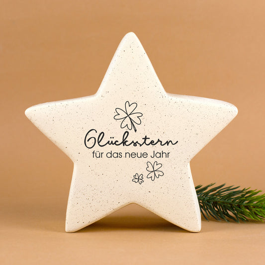 Großer cremefarbener Keramikstern mit Glücksstern-Motiv und Text „für das neue Jahr“