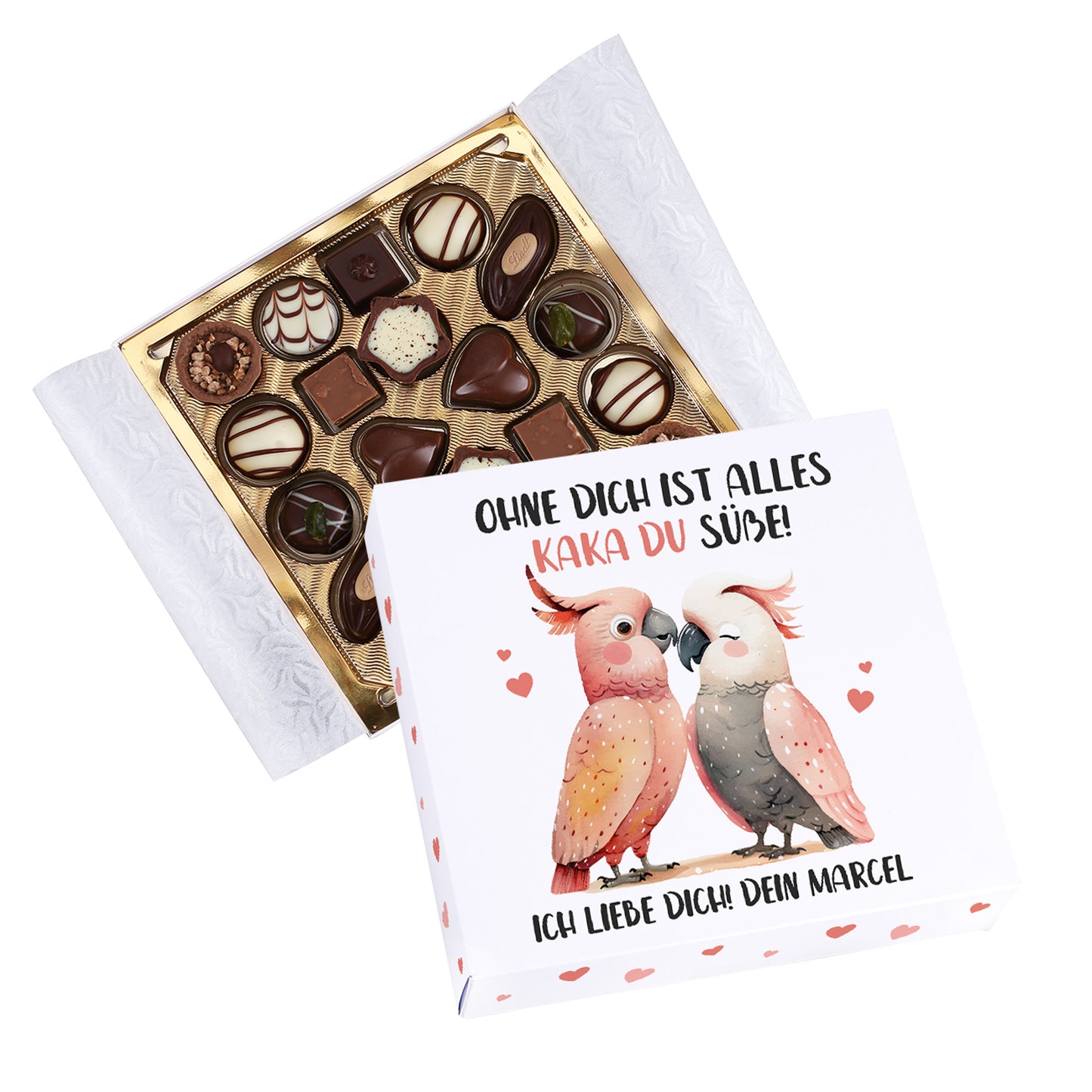 Lindt Pralinenbox mit Kakadu-Motiv und personalisiertem Text neben geöffneter Pralinenschachtel freigestellt