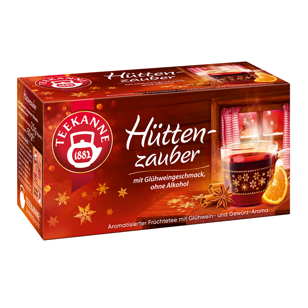 Freigestellte Teepackung „Teekanne Hüttenzauber“ im rot-goldenen Winterdesign mit Glühweintasse und Orangenstück.