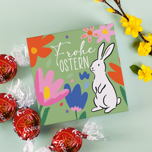 Oster Geschenkbox mit 4 Lindt Lindor Kugeln und buntem Hasenmotiv „Frohe Ostern“