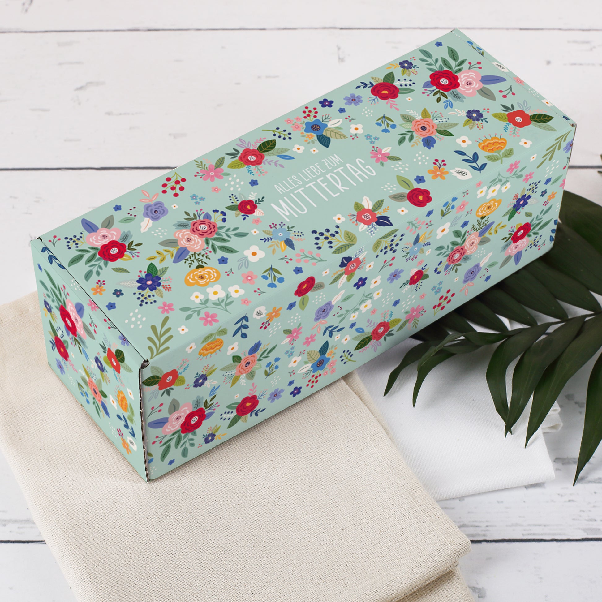 Florale Geschenkverpackung in länglicher Form – ideal für Flaschen oder Gläser – Muttertagsmotiv mit Aufschrift auf dem Deckel