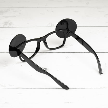 Rückansicht der Spaßbrille 40 im Verkehrszeichen-Look aus schwarzem Kunststoff