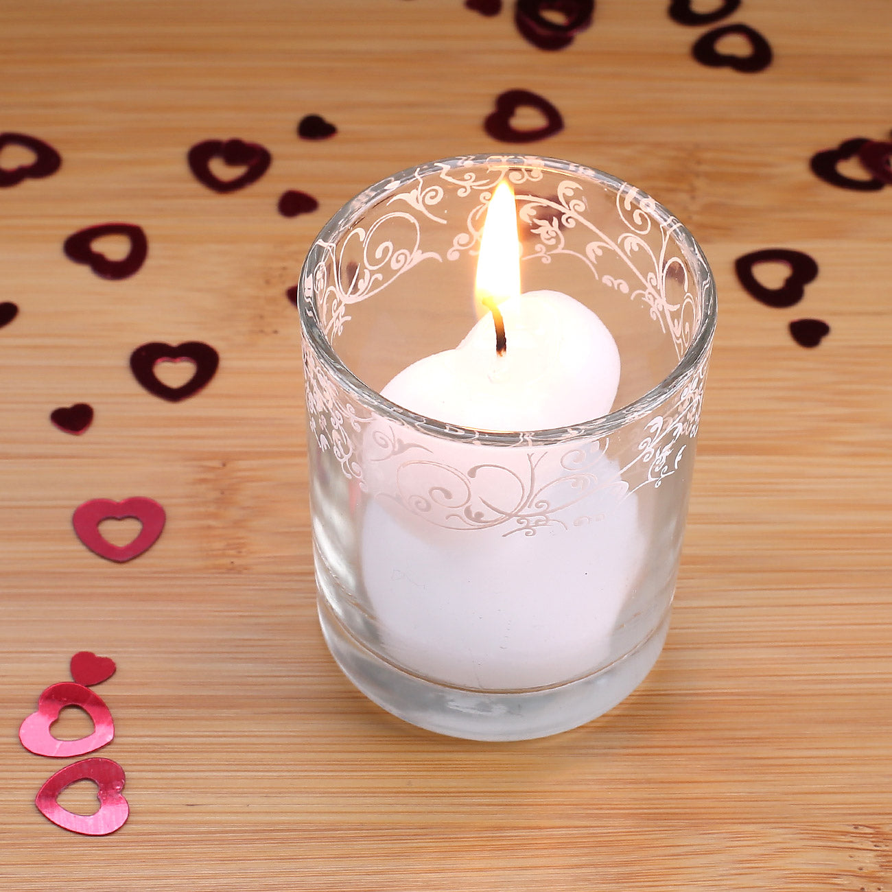 Herzförmige Kerze im Glas weiß