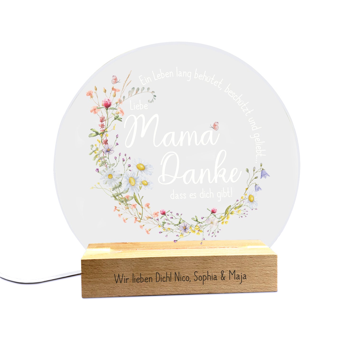 LED-Acryllampe mit floralem Design und liebevoller Widmung zum Muttertag. Der Schriftzug „Mama Danke, dass es dich gibt!“ ist von einem filigranen Blumenkranz umrahmt. Der Holzsockel kann mit einer individuellen Gravur personalisiert werden. Ein besonderes Geschenk für Mütter, das Wärme und Wertschätzung ausstrahlt.