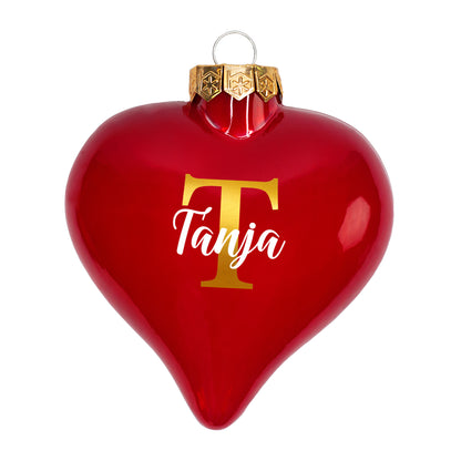 Einzelne rote Weihnachtskugel mit Initiale T und Name Tanja auf weißem Hintergrund