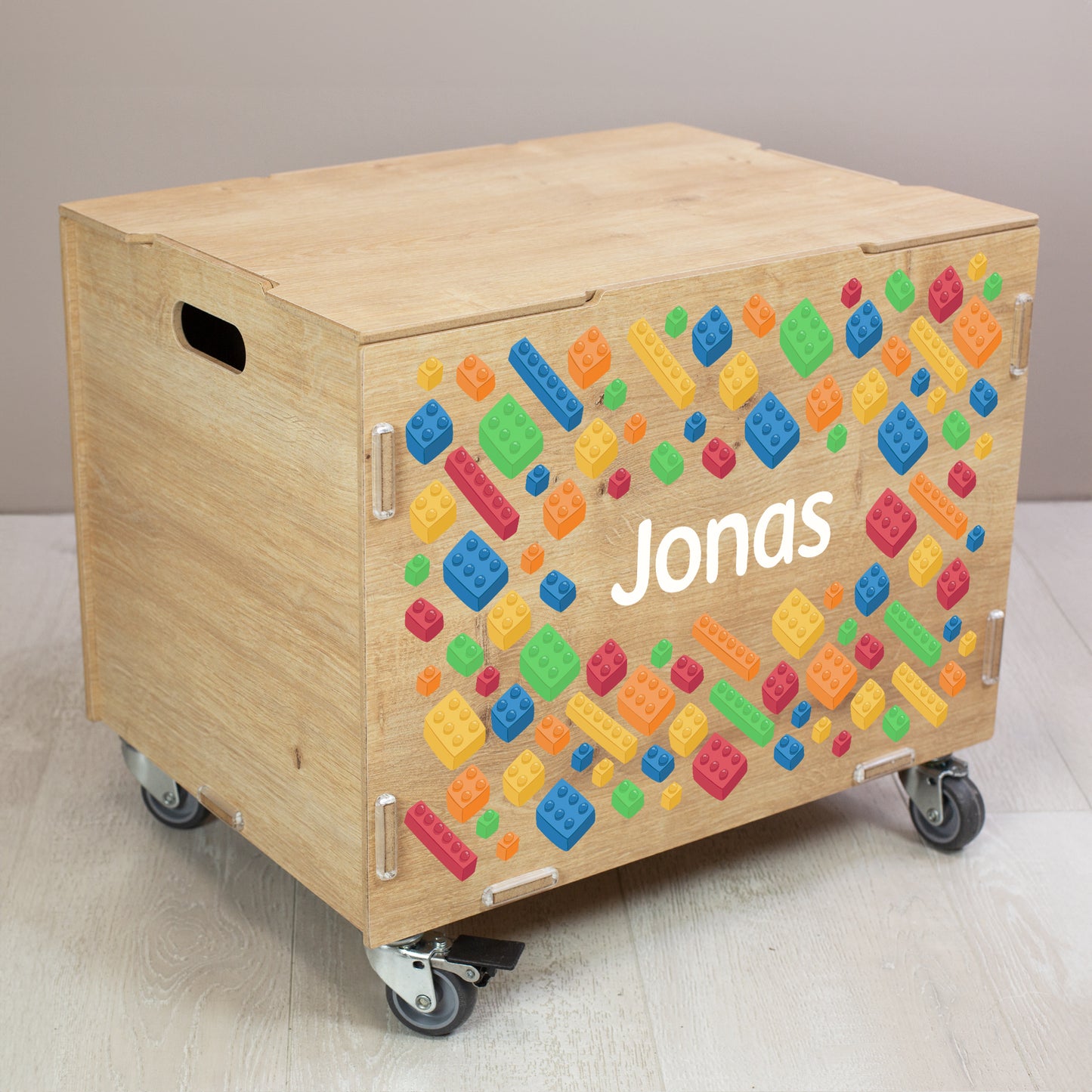 Personalisierte Rollbox aus Holz von clipfritz - Bunte Bausteinwelt | Kinder-Spielzeugkiste mit Name