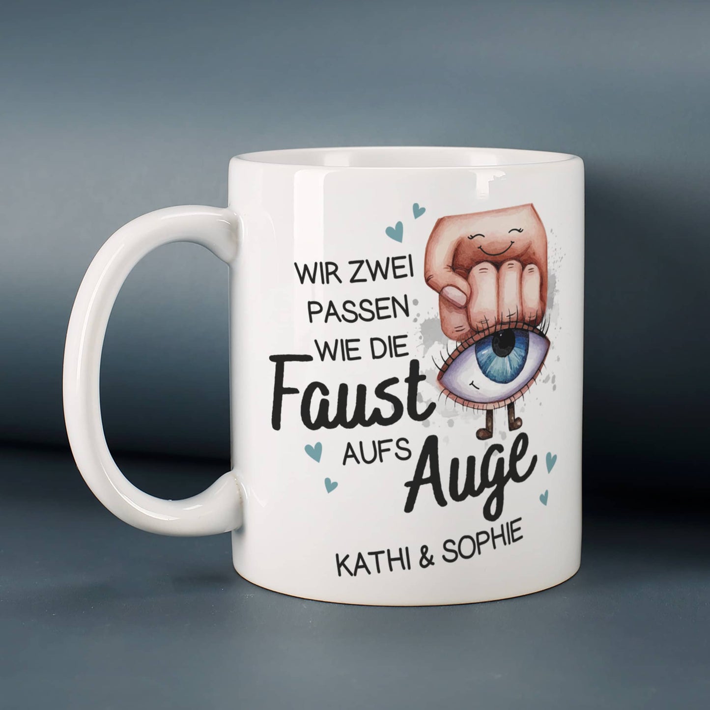 Wir zwei passen wie die Faust aufs Auge - Tasse mit Ihren Wunschnamen