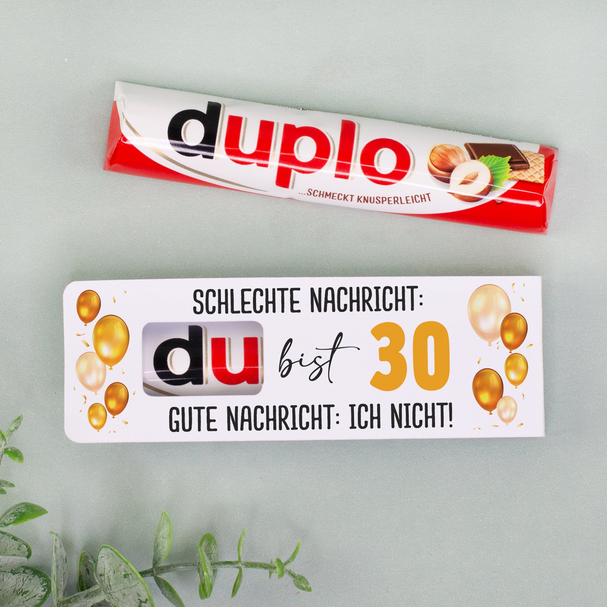 duplo Riegel und personalisierte Geburtstagsverpackung mit Ballonmotiv nebeneinander