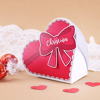 Personalisierte Faltschachtel für Pralinen in Herzform mit Schleife