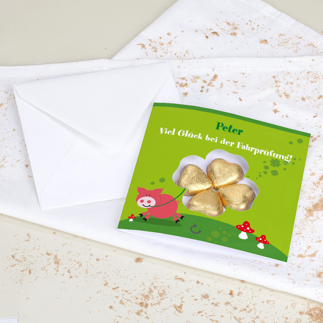 Glückwunschkarte mit Lindt Schokoladen-Kleeblatt und Wunschtext