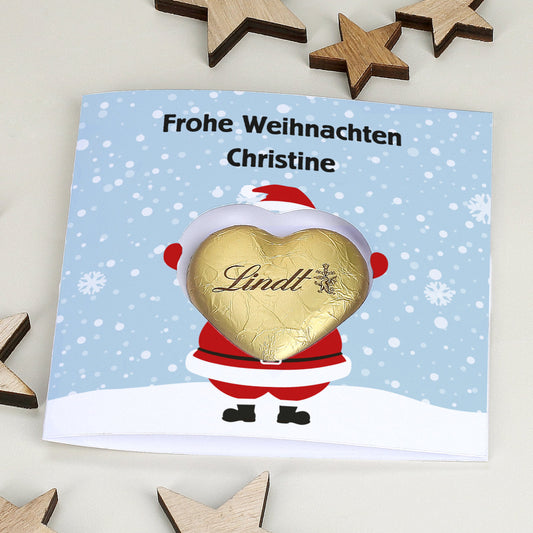 Karte mit Weihnachtsdruck und Lindt Schokoherz