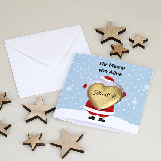 Karte mit Weihnachtsdruck und Lindt Schokoherz