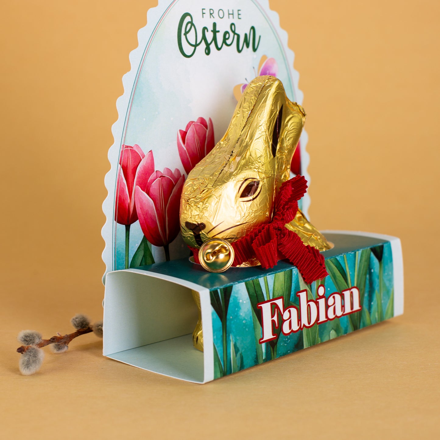 Lindt Goldhase in personalisierter Osterverpackung mit Wunschname "Frohe Ostern"