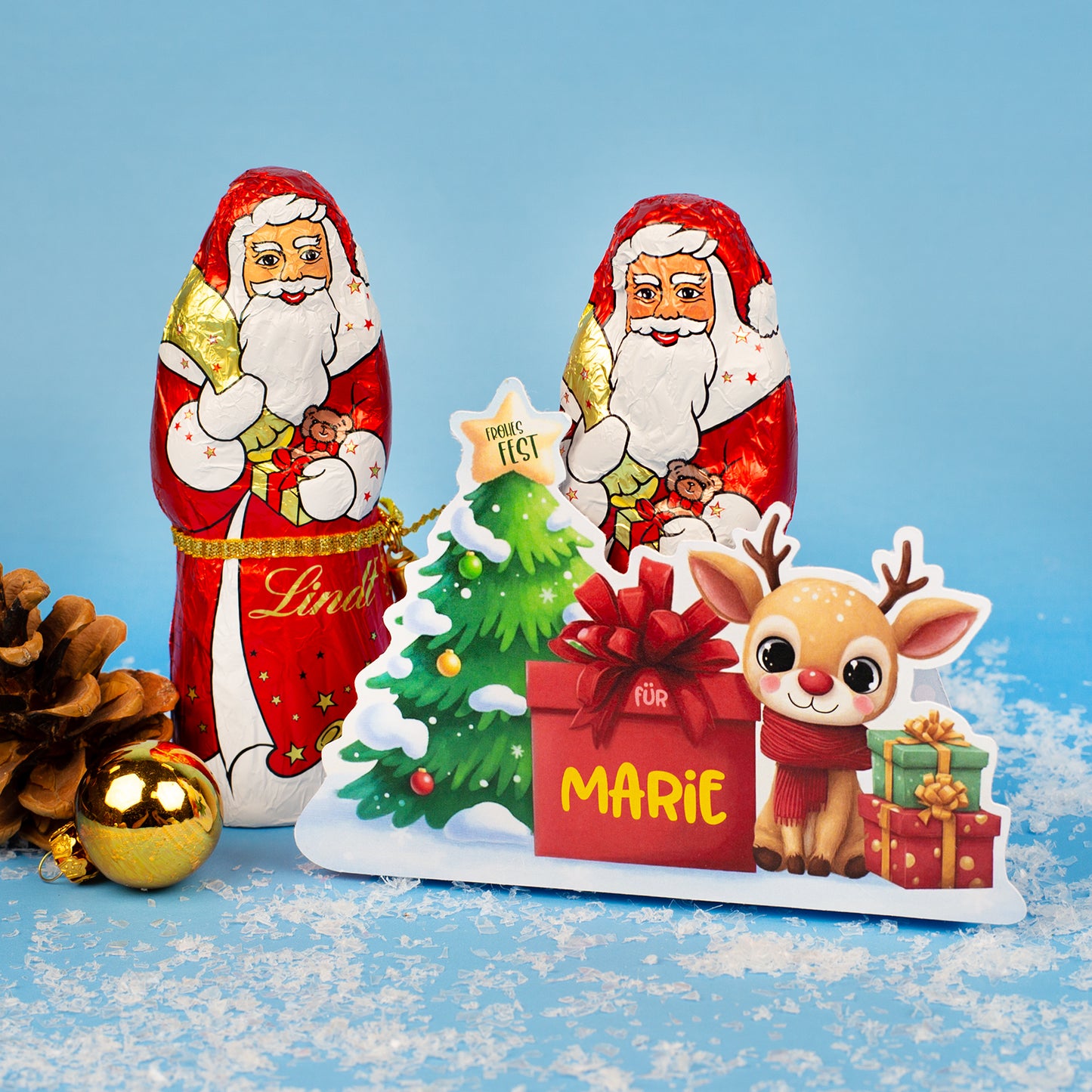 Personalisierte Rentier-Verpackung mit Lindt Weihnachtsmann und Name „Marie“ – Weihnachtsmotiv vor blauem Hintergrund