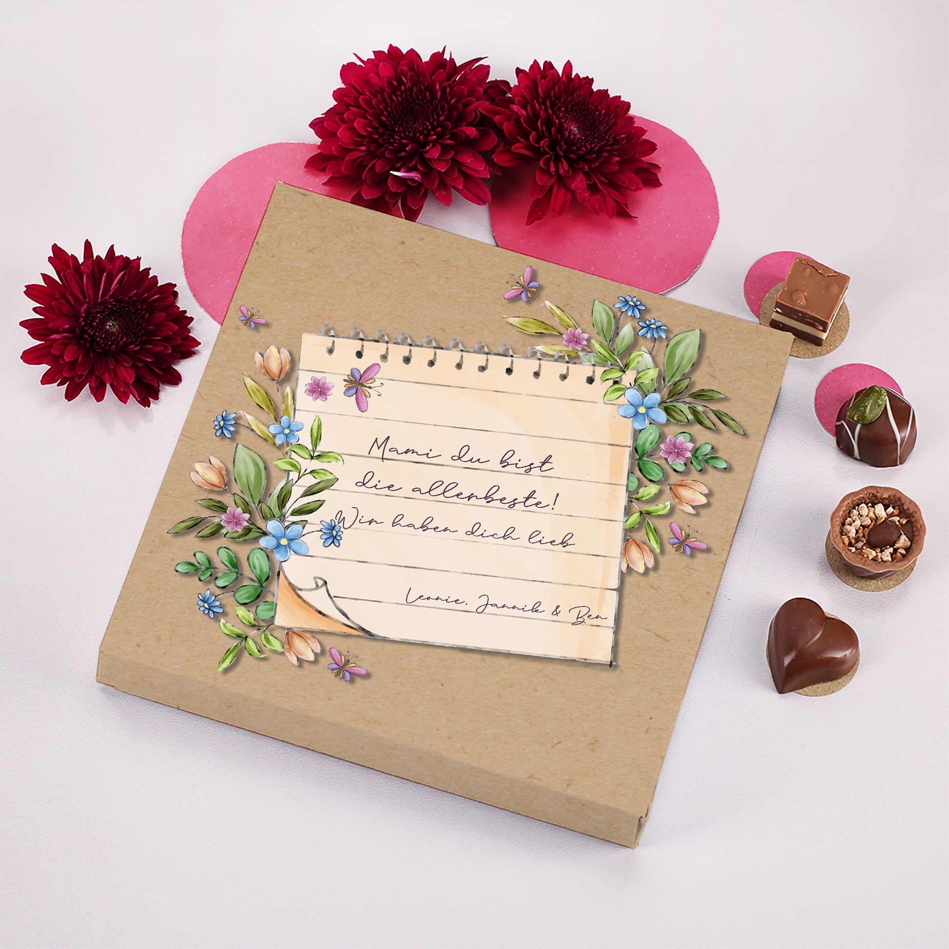 Lindt Pralinen Geschenkbox mit personalisiertem Text und Blumen dekoriert mit Pralinen und Blüten