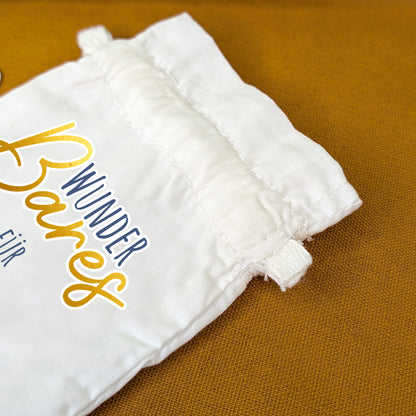 Detailaufnahme vom Zuziehkordel und Motiv „WunderBares“ in Großaufnahme