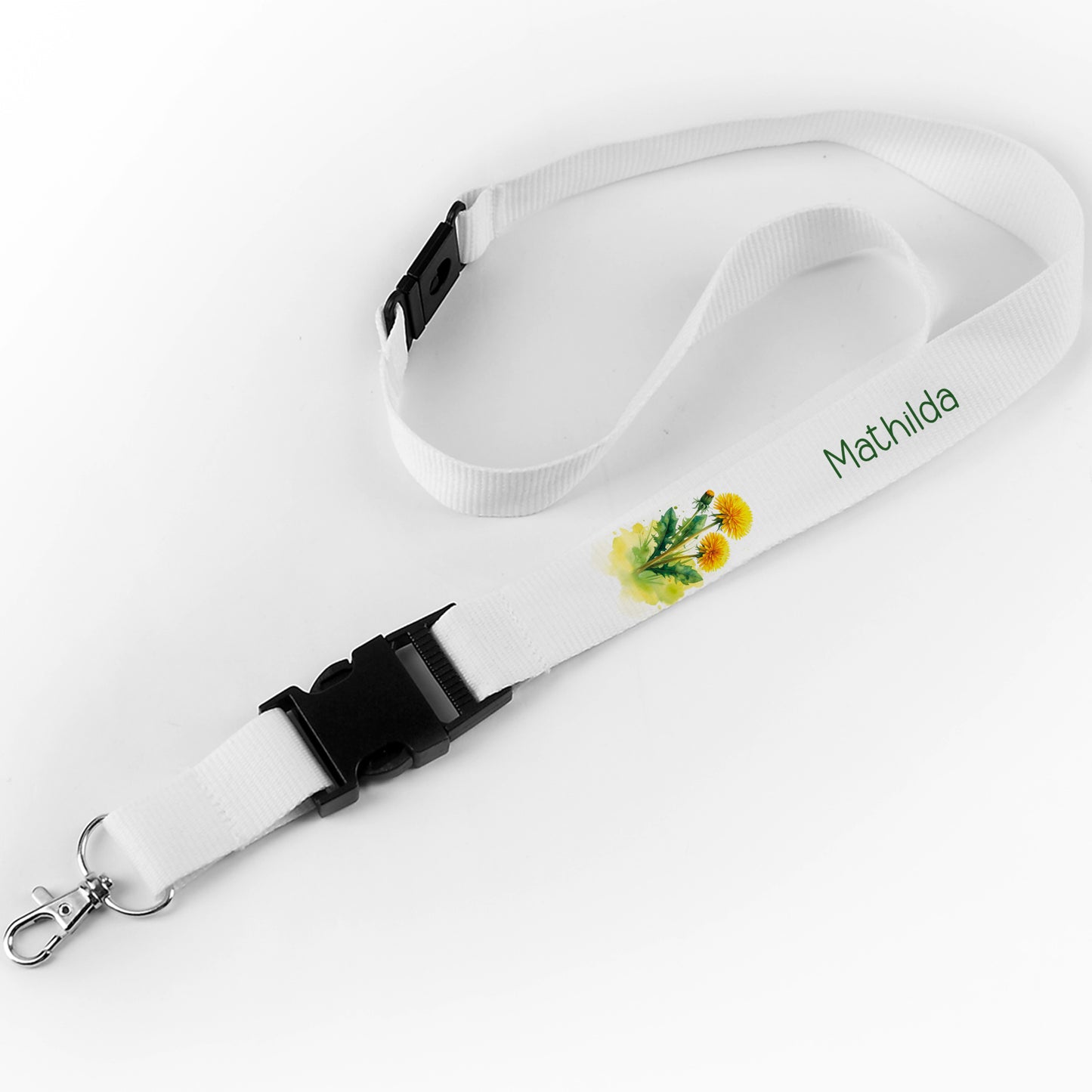 Schlüsselband mit dem Namen "Mathilda" und gelbem Löwenzahn-Design auf weißem Hintergrund