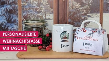 Personalisierte Weihnachtstasse mit Namen Schneekugelmotiv. Wird in passender Geschenkverpackung eingepackt. 